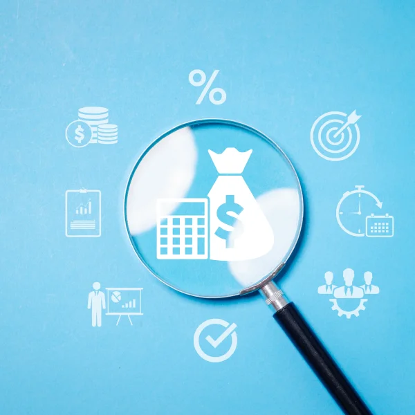  A magnifying glass over a money bag symbolizes budget analysis and financial planning on a blue background.